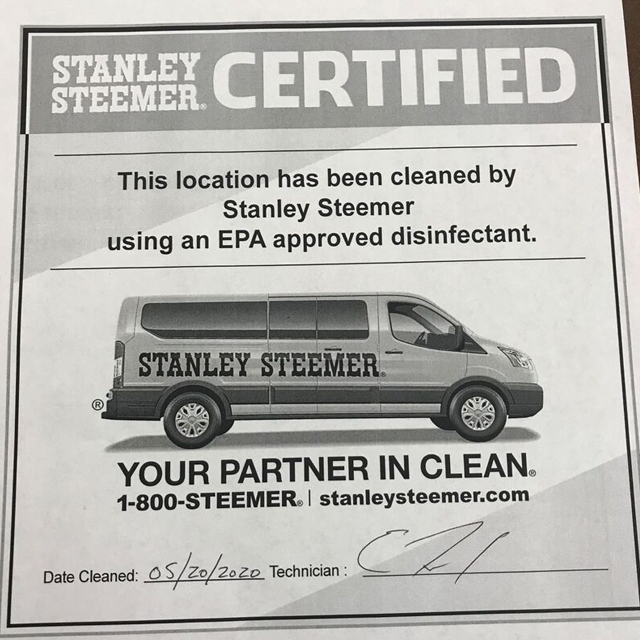 Stanley Steemer certified cleaning certificate dated 05/20/2022 with technician signature and service van image.