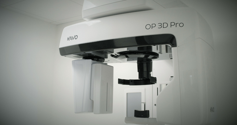 KAVO OP 3D Pro dental imaging equipment mounted on white ceiling in clinical setting.